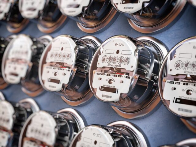 Electrical meters are arranged in rows, measuring usage in an apartment building.